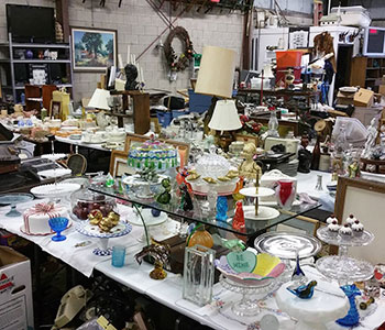 A array of different kinds of antique items including porcelain and lamps 